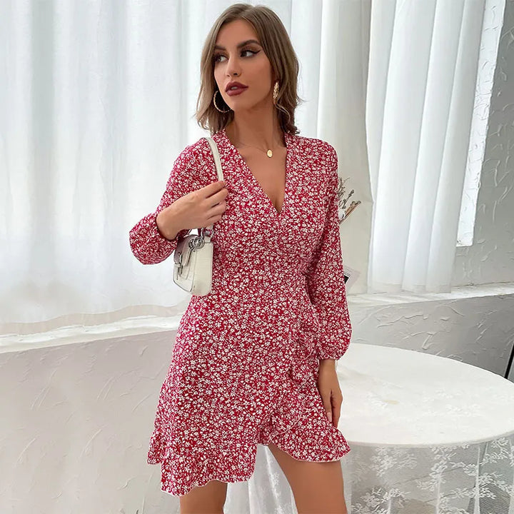 Beautiful women's floral wrap mini dress featuring V-neck, long sleeves, ruffle detail, and adjustable tie waist.