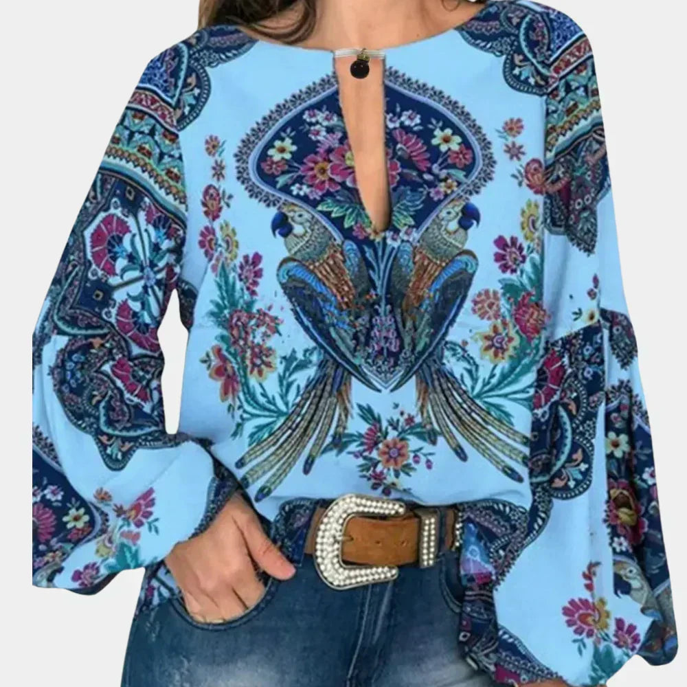 Woman wearing a stylish breezy floral print blouse, showcasing a relaxed summer fashion look.