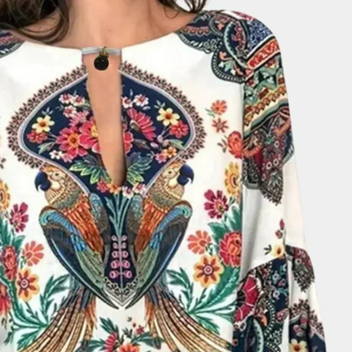 Floral print women's summer blouse. Lightweight, breezy, cap sleeve, casual chic for vacation.