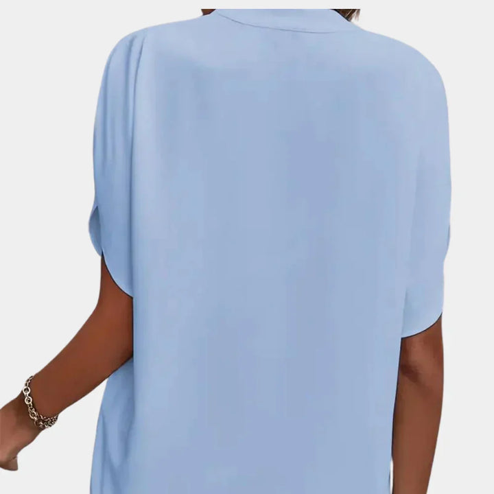 Comfortable women's loose fit summer blouse, short sleeve, ideal for breezy vacation style.