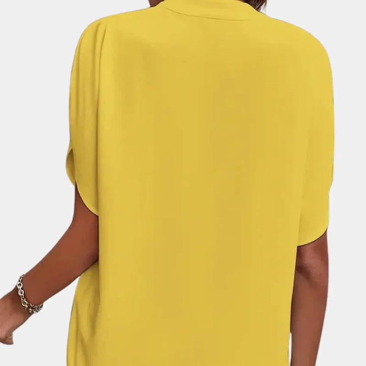 Women's airy short sleeve blouse, a versatile and comfortable summer top for daily wear.