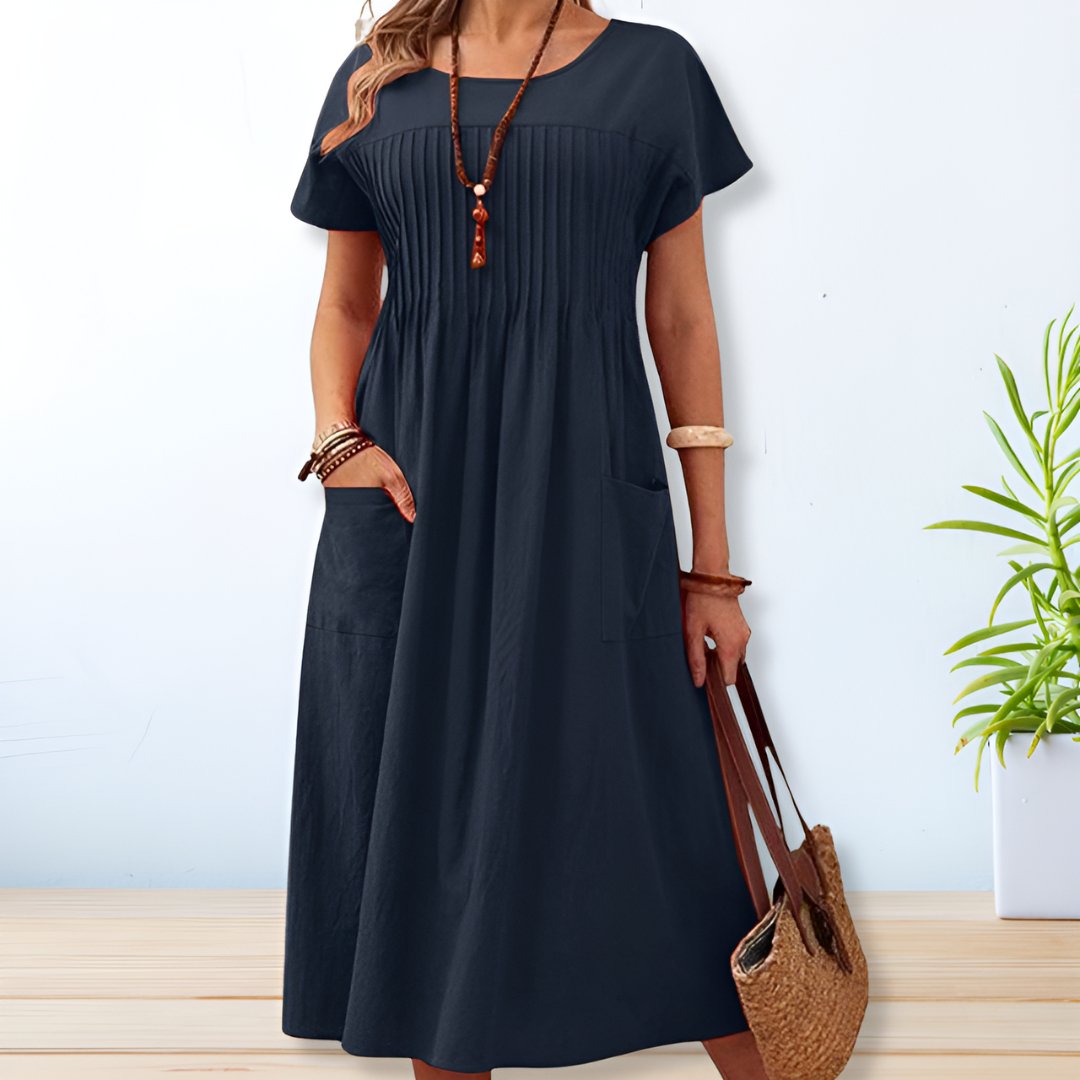 Comfortable short sleeve midi day dress for women, featuring a relaxed fit and practical pockets for casual style.