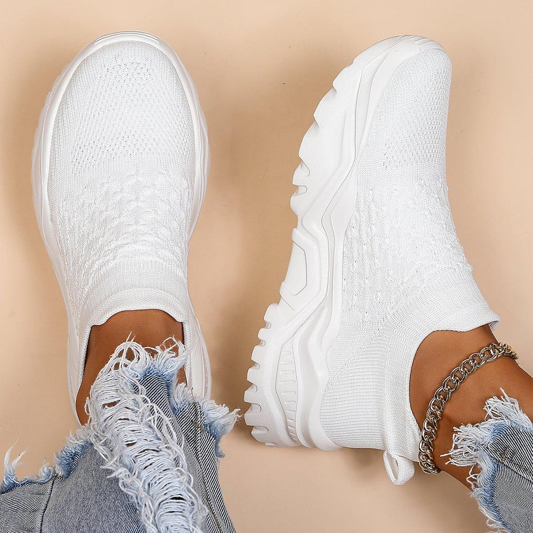 Ezwear unisex white slip-on shoes, providing orthopedic comfort and support for everyday activities.