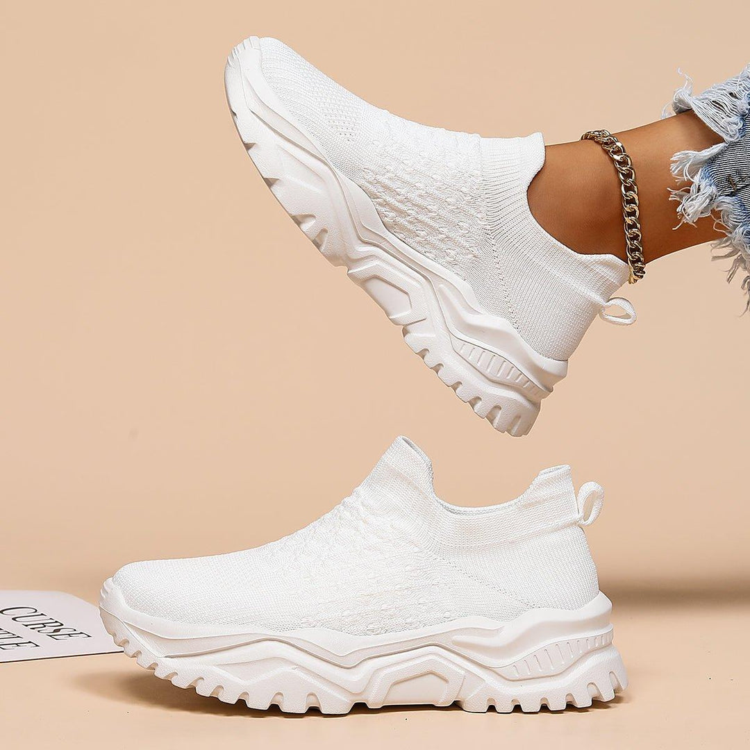 Orthopedic white slip-on footwear, designed for unisex comfort and ease of wear in professional settings.