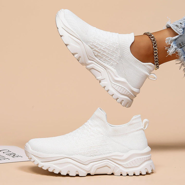 Orthopedic white slip-on footwear, designed for unisex comfort and ease of wear in professional settings.