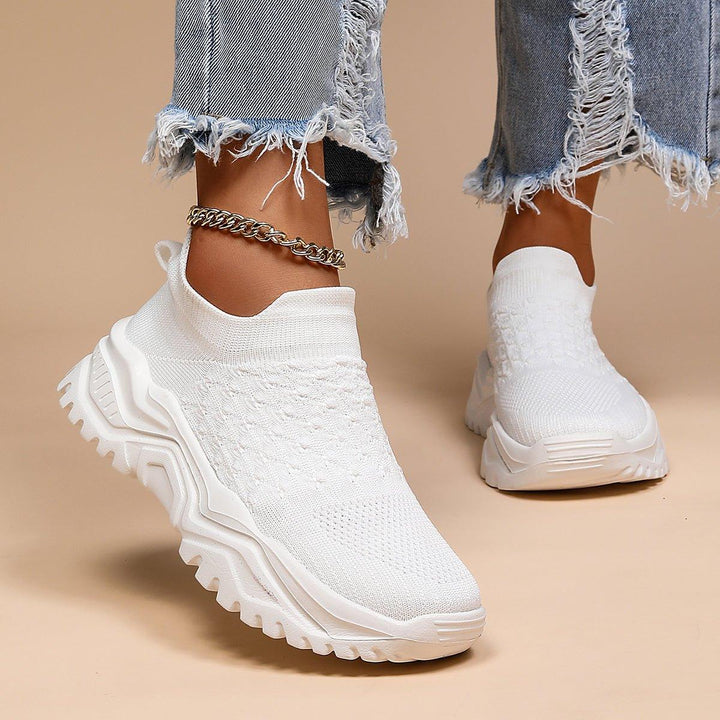Lightweight white slip-on shoes with advanced cushioning, perfect orthopedic comfort for any user.
