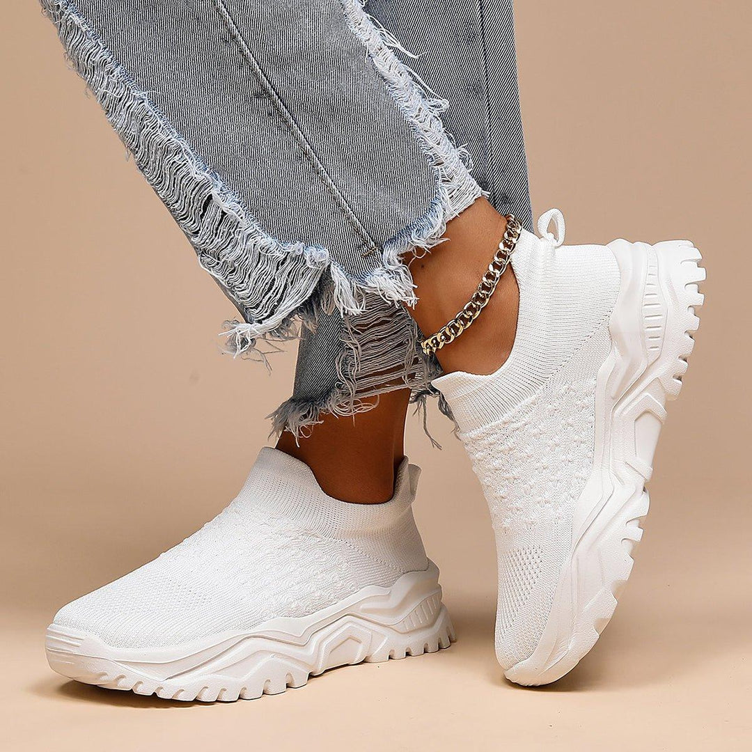 Unisex comfort footwear: all-white orthopedic slip-on shoes, ideal for work or casual wear.