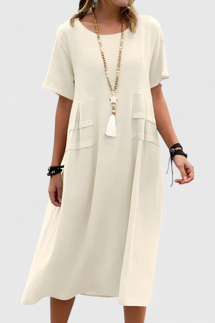 Elegant women's midi dress in a flattering cut, perfect for evening events or chic casual wear. Timeless fashion.
