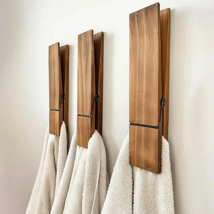 Elegant modern wood towel holder clip, wall mount for bathroom organization. Natural wood, Scandinavian design.