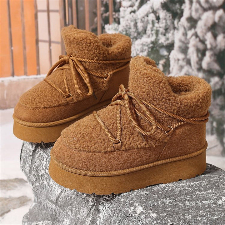 Front view of Aurelia women's cozy boots, emphasizing the secure lace-up closure and solid construction.