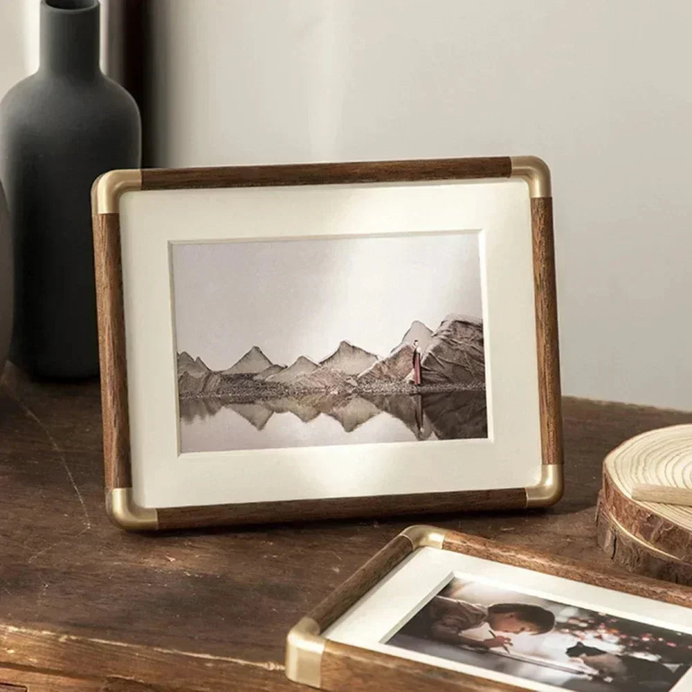 Freestanding acrylic photo frame with magnetic closure, offering a sleek, modern photo display for home decor.