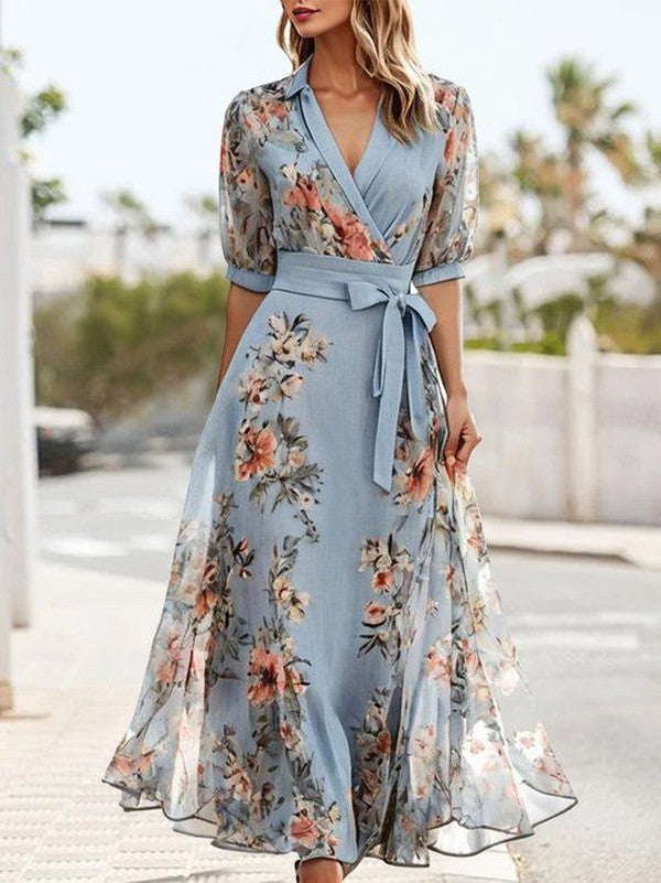 Charming women's light blue floral print wrap midi dress with flattering V-neck & 3/4 sleeves, ideal for summer parties.