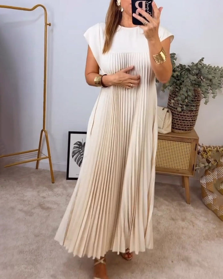 Flat lay of a women's flowing pleated maxi dress, showcasing its elegant design, comfortable fabric & versatile appeal.