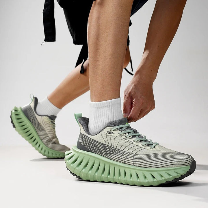 Unisex running shoes for men & women, black with green accents, front view, comfortable fit