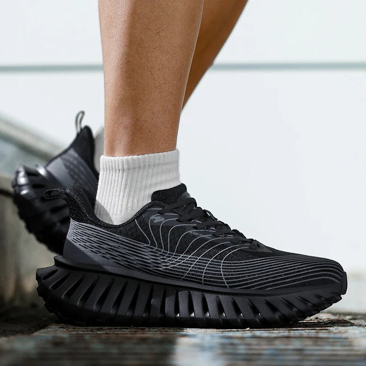 Pair of black and green unisex athletic shoes, ideal for running & gym workouts