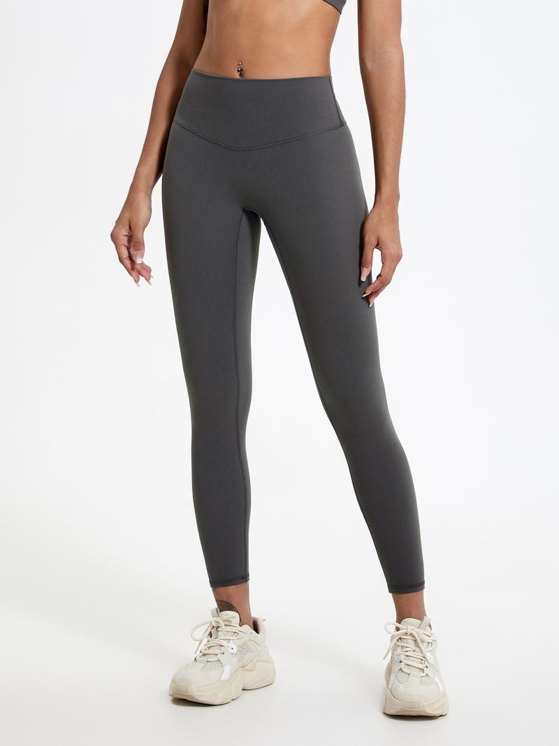 Woman modeling high-waisted sculpting leggings, flattering fit for activewear and everyday comfort