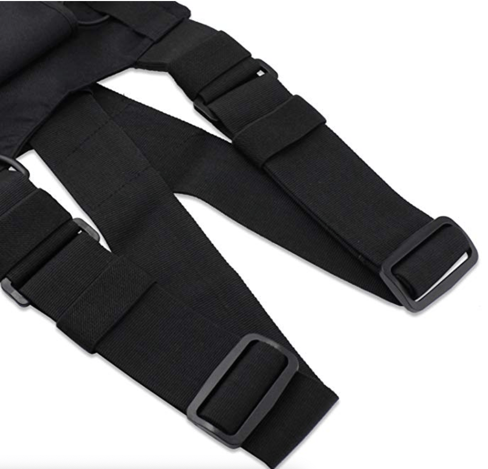 Close-up of black tactical chest rig harness bag, showing pocket details and adjustable buckles