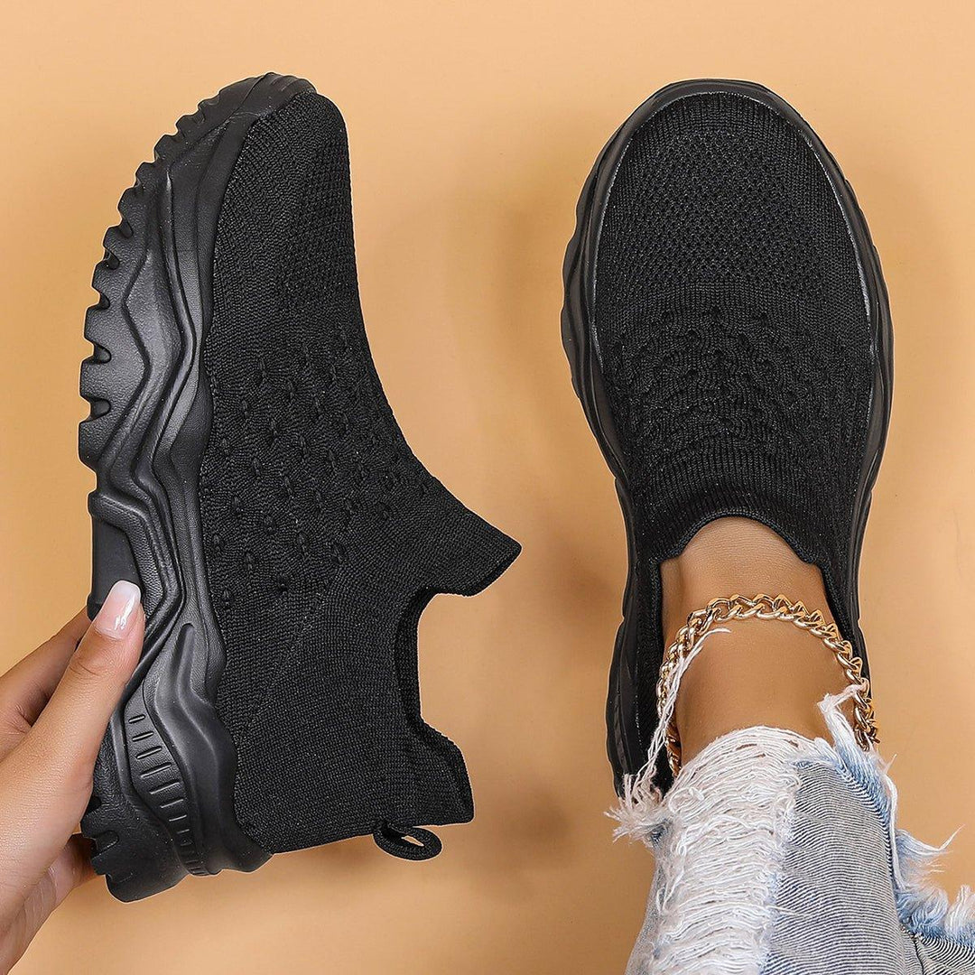 Black unisex orthopedic cloud slip-on shoes, offering comfort and support for everyday wear.