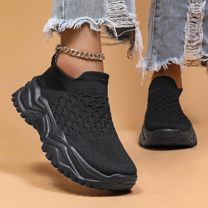 Orthopedic cloud slip-ons in black, providing comfort and support for any activity.
