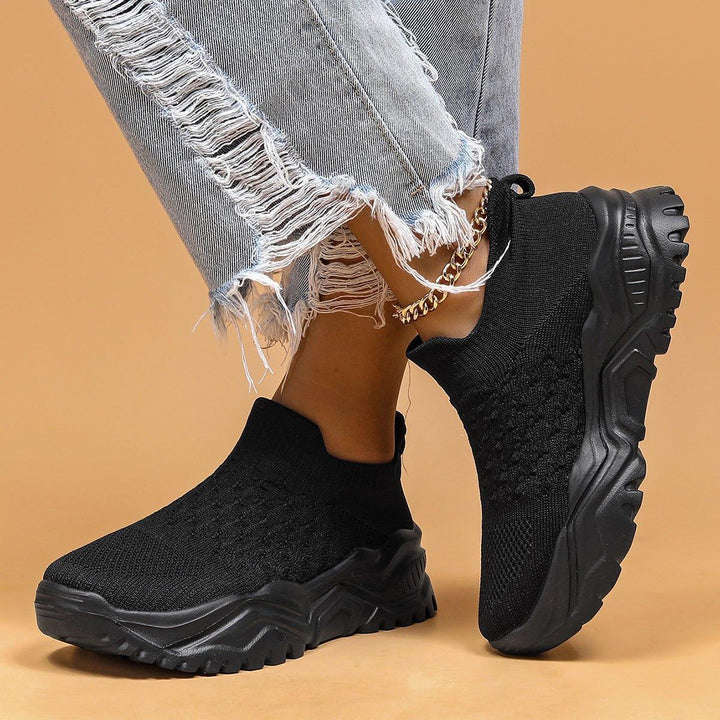 Soft black unisex slip-on shoes, engineered with orthopedic features for foot health.
