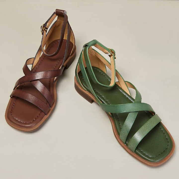 Detail of the buckle closure on a women's green leather ankle strap sandal, comfort focused