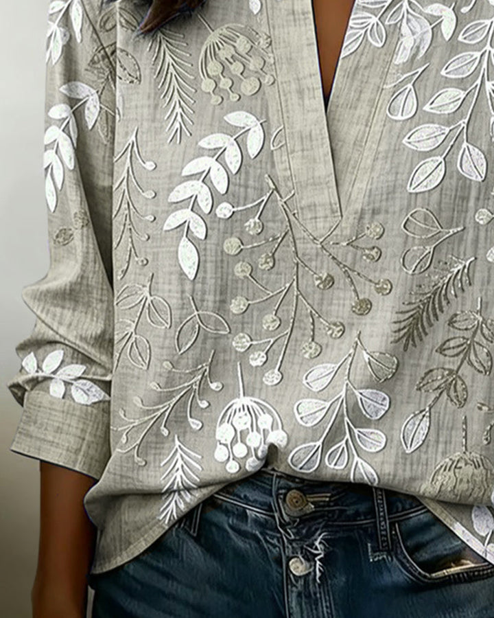 Sophisticated Women's Pastel Floral V-Neck Blouse, great for a casual elegant look.