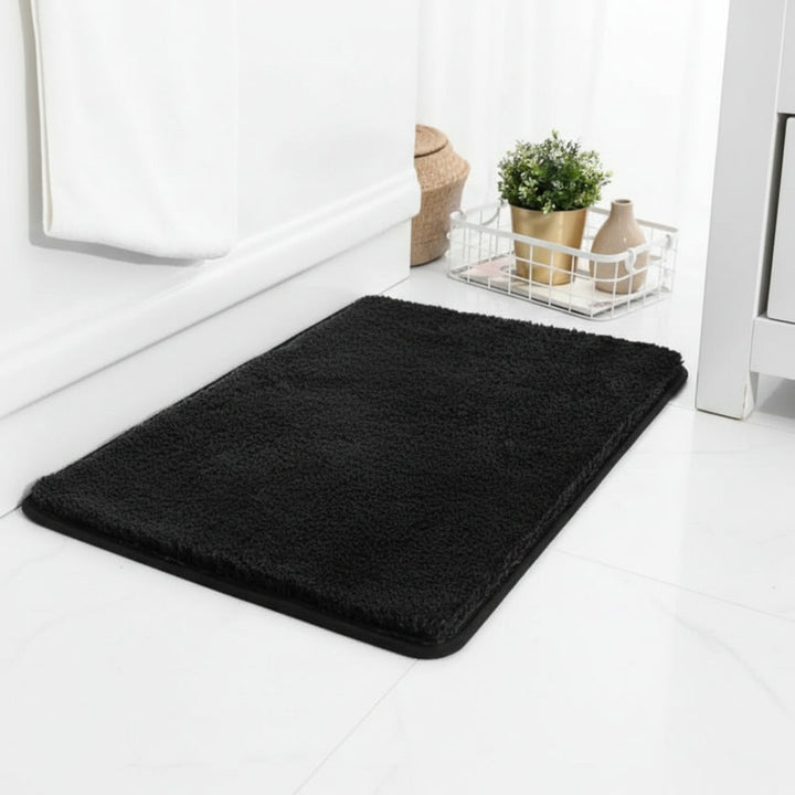 Elegant absorbent bath mat in a modern bathroom setting. Soft, non-slip bathroom accessory for safety & style.