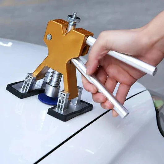 "Car dent repair puller tool with high-carbon steel handle and silicone base, ideal for paint-safe dent removal."