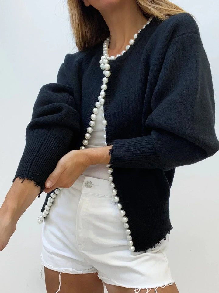 Chic women's long-sleeve knit cardigan with pearl embellishments, a fashionable & elegant layering piece.