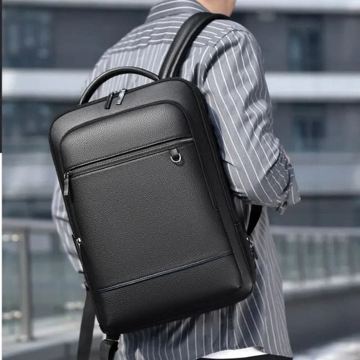 Modern black smart backpack with USB charging, designed for urban professionals & daily commute needs.