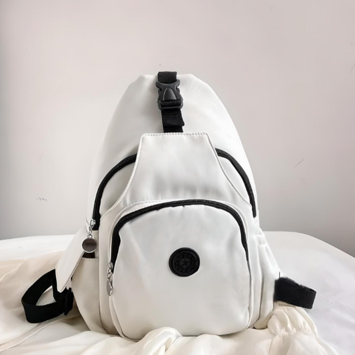Unisex anti-theft sling bag, sleek black, featuring hidden pockets for secure daily carry or travel. Crossbody design.