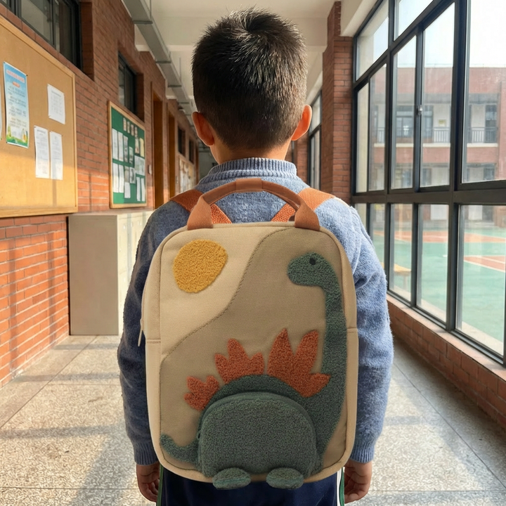 Toddler adventure dinosaur rucksack in beige. Durable children's school bag, ideal for playtime and daily use.