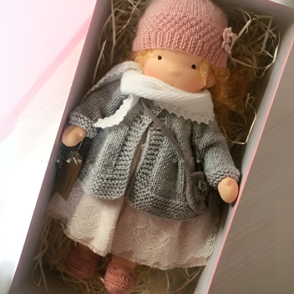 Gentle Waldorf doll, handcrafted from natural materials, perfect for children's play.
