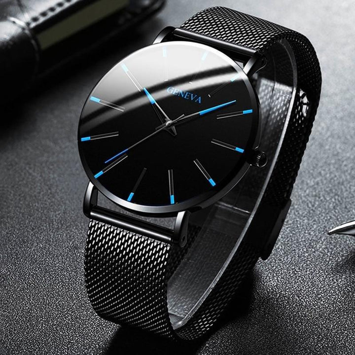 Close-up of the stylish men's minimalist watch face showcasing blue indices and a clean black dial.