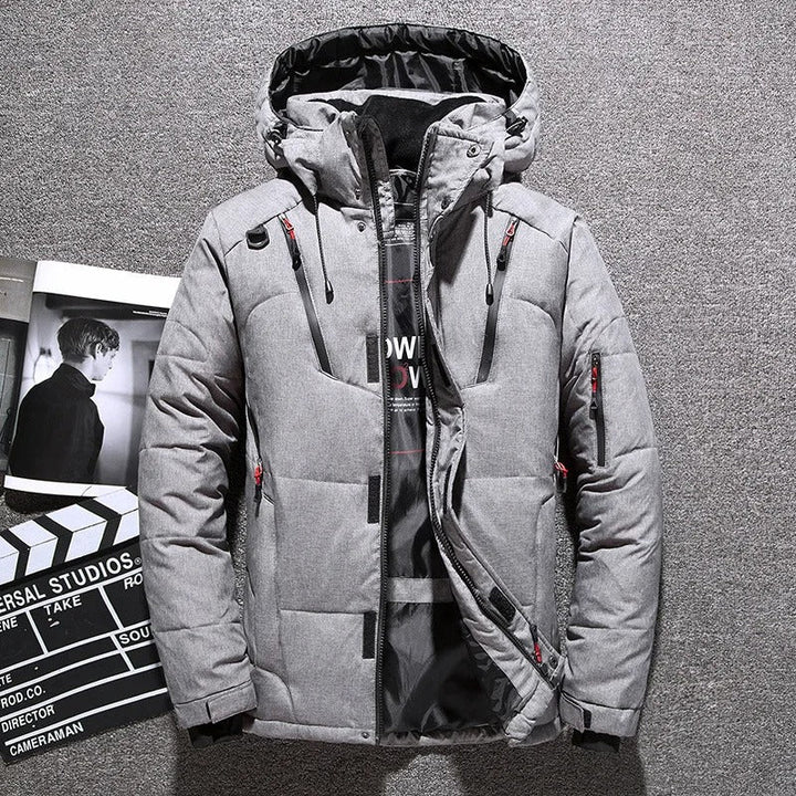 Rugged men's insulated hooded parka, offers warmth & protection for winter adventures.