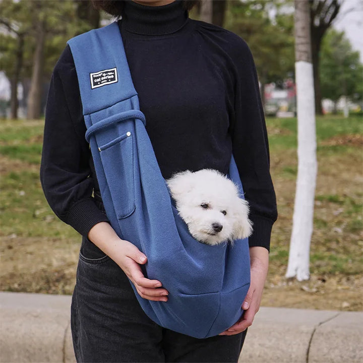 Small dog & cat sling carrier, a travel bag with adjustable strap for ultimate pet comfort & owner convenience.