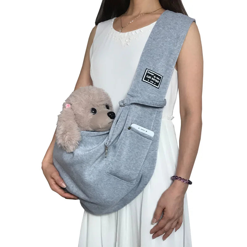 Hands-free pet sling carrier for small dogs & cats, with an adjustable strap. Great for travel & daily errands.