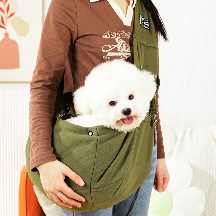 Comfort pet sling carrier for small dogs & cats. Features adjustable strap & breathable fabric for hands-free travel.