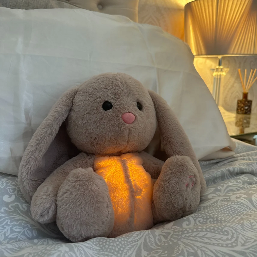 Relaxation aid: soothing plush toy with gentle light for adult comfort. A soft, huggable bedtime friend.