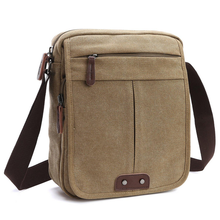 Versatile canvas crossbody bag with multiple compartments, perfect for organizing essentials. Unisex, durable for daily use.