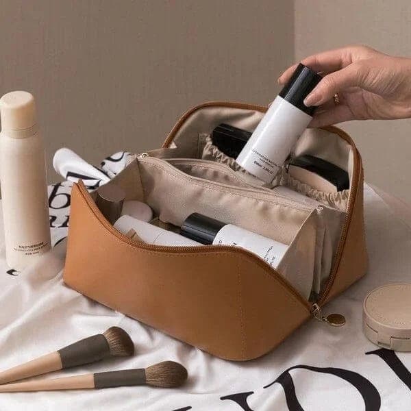 Stylish women's travel cosmetic bag with compartments, perfect for organizing makeup & beauty accessories. Great toiletry storage solution.