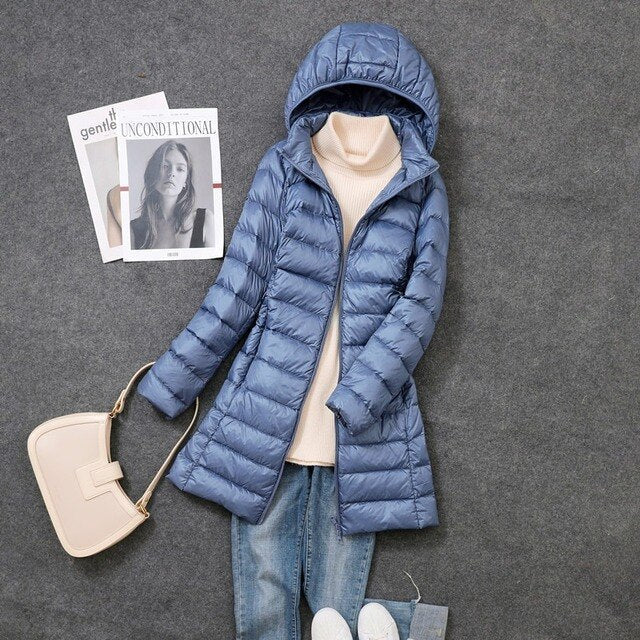 Ladies' long hooded puffer coat, designed for superior warmth & comfort in harsh winter conditions.