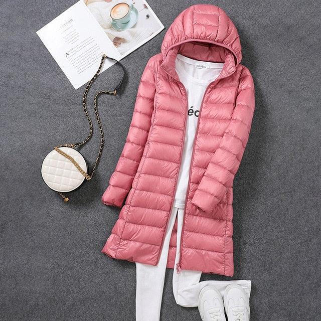 Ultimate warmth in this long hooded puffer jacket for women. A stylish & cozy insulated winter coat.