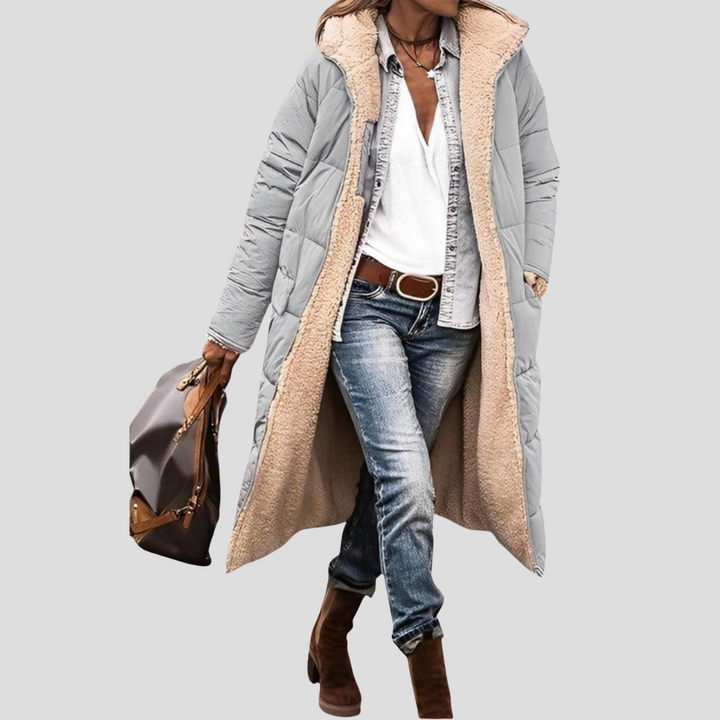 Long women's hooded winter coat, perfect for warmth. Cozy reversible jacket with a stylish design.
