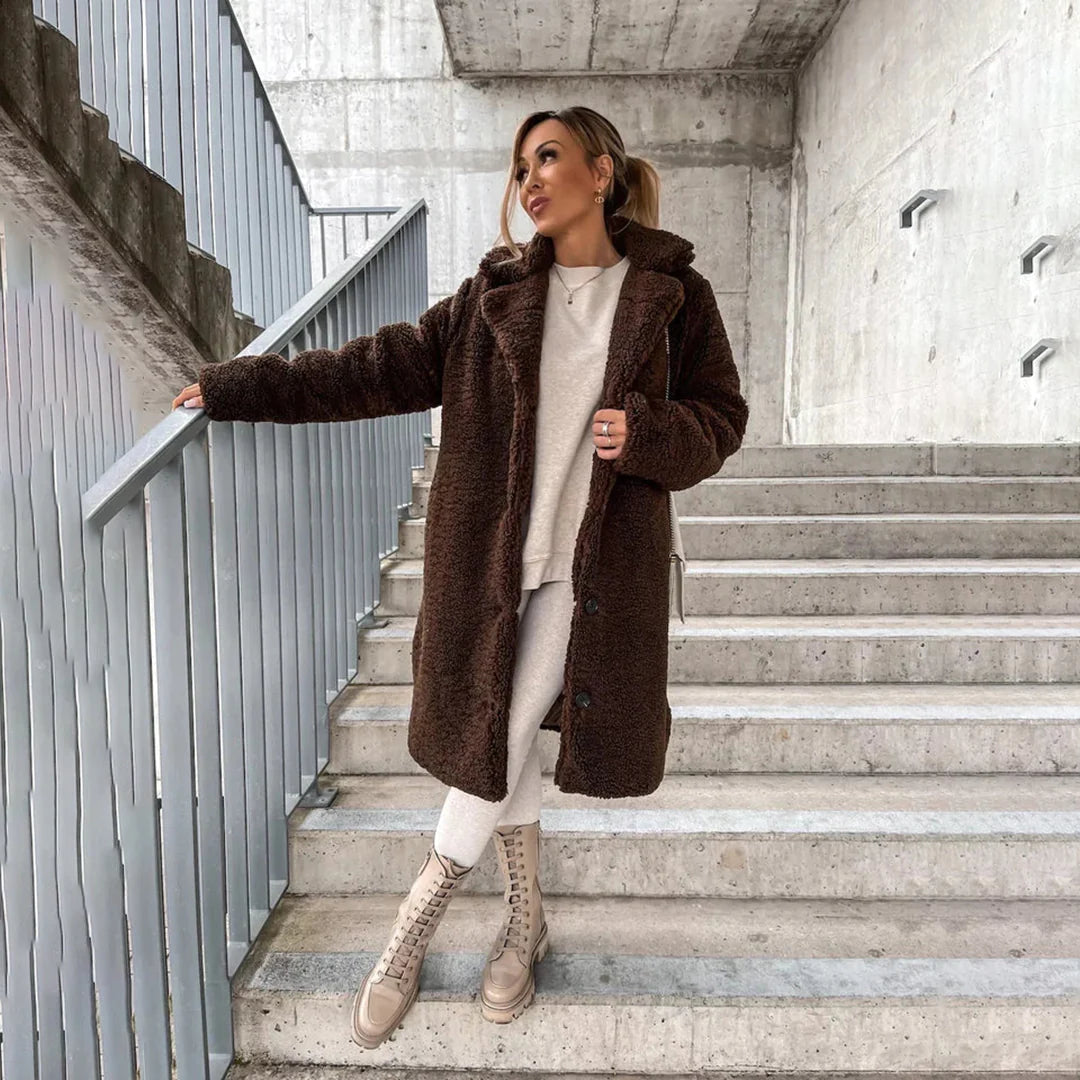 Women's cozy long teddy coat with oversized fit, lapel collar & button closure. Perfect warm winter fashion outerwear.