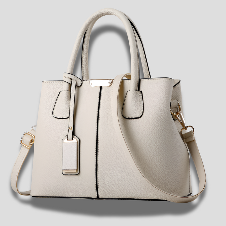 Sophisticated women's structured satchel handbag in a classic style. Ideal for adding a chic touch to any outfit.