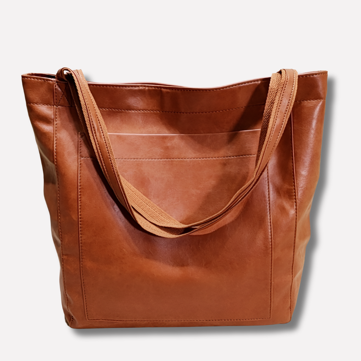 Stylish women's shoulder tote bag. Features an adjustable strap for versatile cross-body or handbag use.