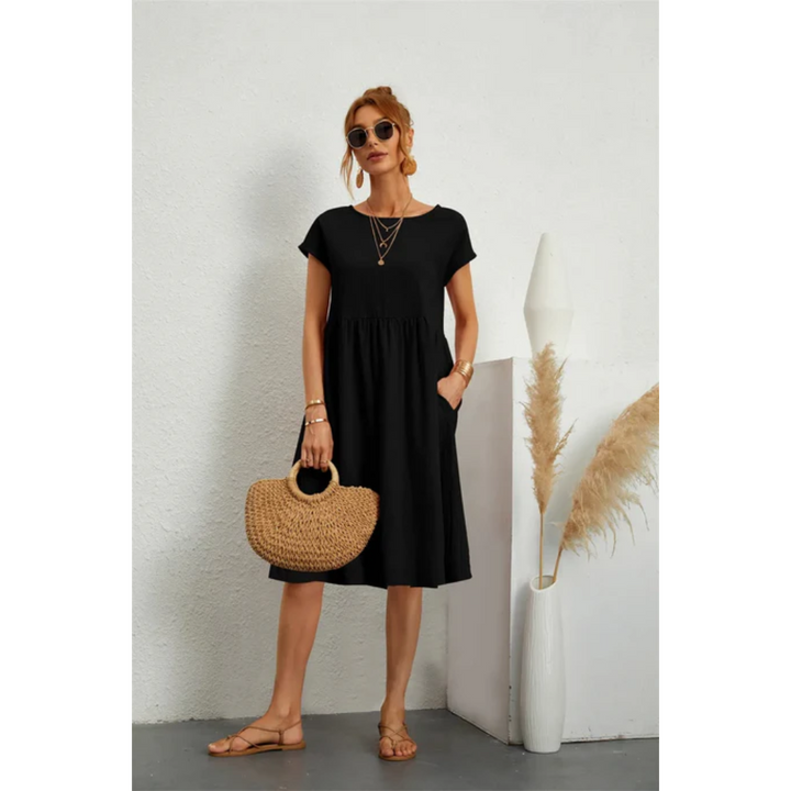 Comfortable women's summer midi dress, A-line style, cap sleeves & pockets, versatile for daily wear.