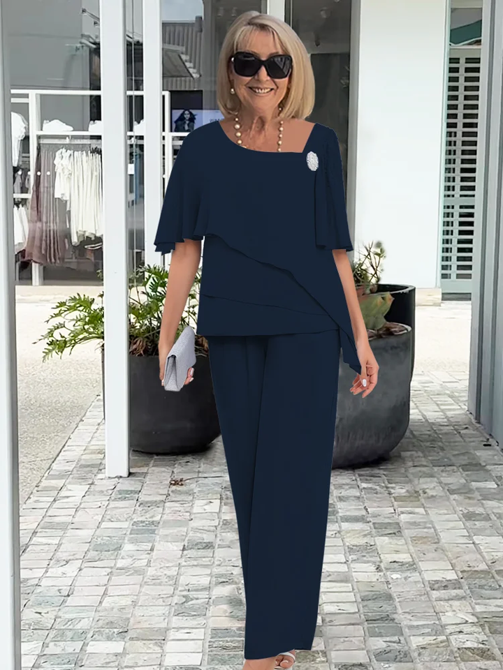 Elegant women's navy blue co-ord set with asymmetrical top and flowy wide-leg pants for formal wear and comfort.