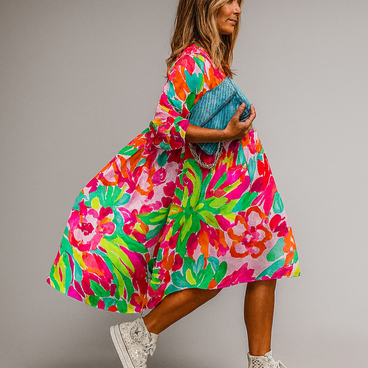 Chic Women's floral print midi shirt dress with puff sleeves. Perfect for summer casual or spring garden parties.